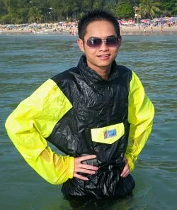 Open water swimmer in anorak and long nylon pants