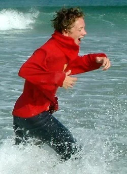 wet hoodie jeans beach running